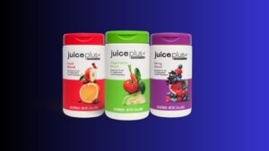 Juice Plus Essentials fruit, vegetable, and berry blend supplements in colorful bottles against a blue background.